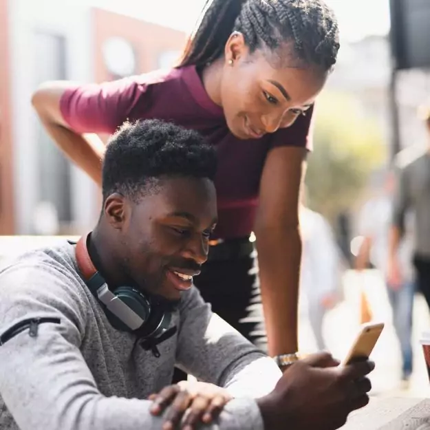 guy and girl looking at the calendar on the phone
